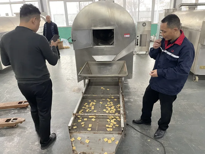 The customer inspected the roasting machine for extruded food.